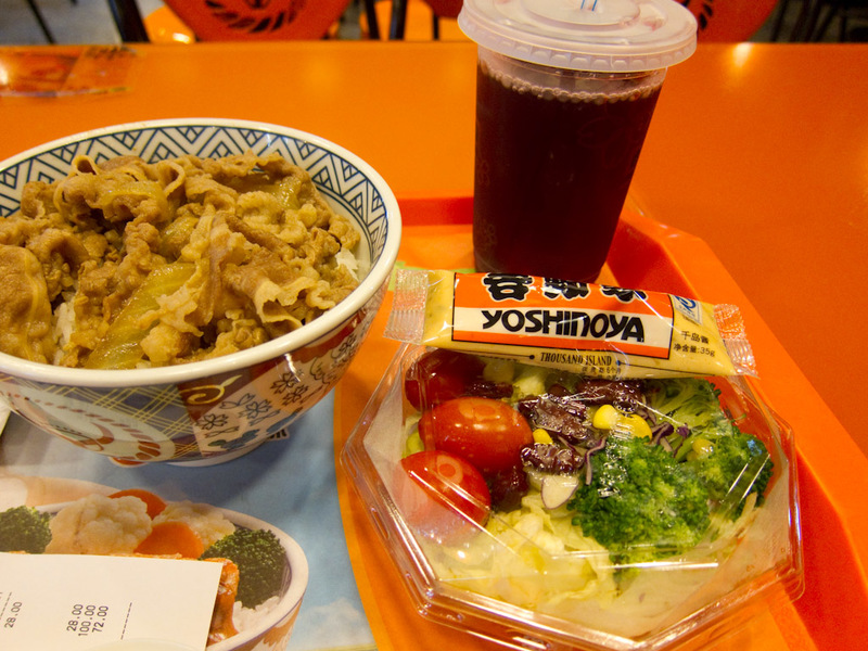 China November 2011 - From Shanghai to Beijing - My dinner at Yoshinoya. Some plain tasting beef on top of a mass of rice. I ate the beef then mixed the salad with the rice. Also, purple drink. Even 