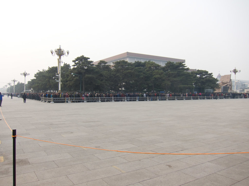 China November 2011 - From Shanghai to Beijing - This is part of the line of people waiting to shuffle past the rubber / fake body of the beloved chairman. Access ends at 12 because they need to reju