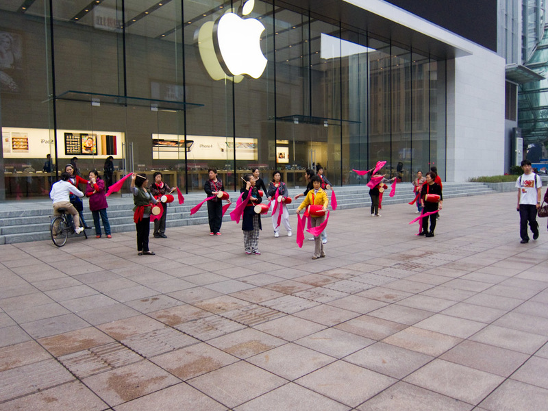 China November 2011 - From Shanghai to Beijing - Falun Gong flag wavers protesting apple. Occupy apple!
