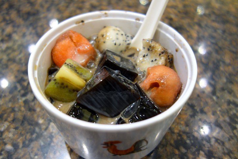 Back to China - Shanghai - Nanjing - Hangzhou - 2012 - I couldnt eat all my dinner so I thought I would have dessert. Unfortunately this was some nice looking fruit with cubes of grass jelly, which would h