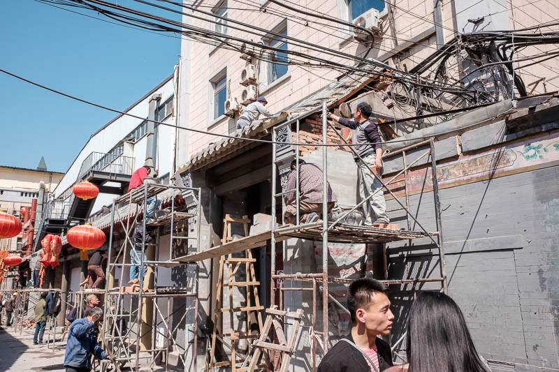 The great loop of China - April 2018 - These guys are getting pretty close to the wires while they glue a few bricks half back together. Actually there really was not too much dodgy work go