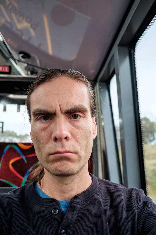 Melbourne-Skybus-Architecture - And here I am, looking even older than on my last trip 6 months ago. Still no grey hairs. Each time I wash my hair in the shower entire handfuls of ha