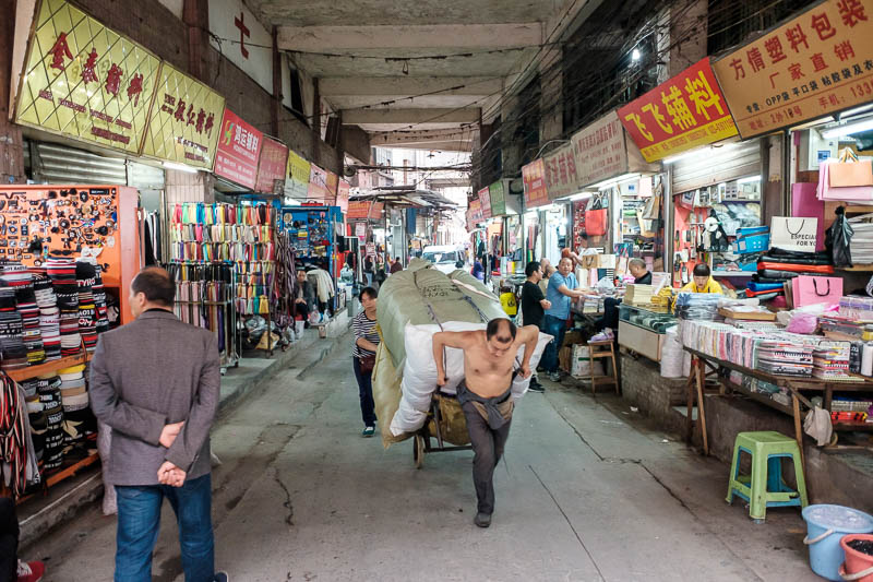 The great loop of China - April 2018 - I made it back down to a street level. Shirtless men dragging stuff around the place are everywhere here.
