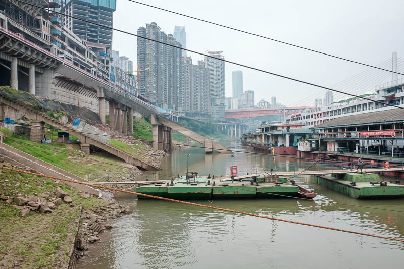 China-Chongqing-Yangtze-Chaotianmen - I walked all the way around the point at water level hoping to find a way back to the area where my hotel is. No, not possible. That red bridge IS THE