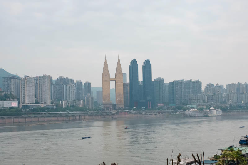 The great loop of China - April 2018 - Across the river are two by twin towers, the gold and the black. I am not sure who was first, I remember seeing the gold ones last time I was here fro