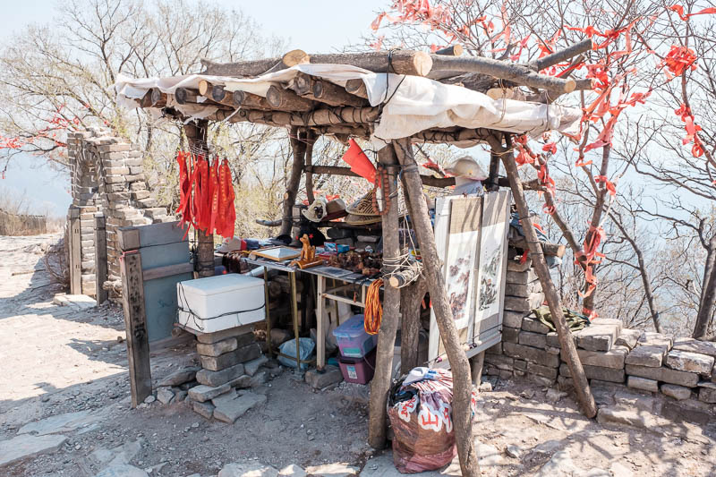 The great loop of China - April 2018 - A guy lives here selling drinks and snacks. Actually he lives in the crumbling watch tower with a dog. He spoke really good English for a quasi homele