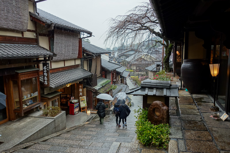 Japan-Kyoto-Rain-Temple-Kinkajuji - A different street looks the same as the last. I think a lot of people have paid to play dress up as a Geisha today, only to find that wooden sandals 