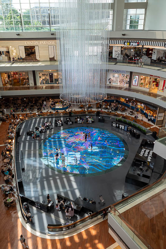Singapore-Gardens by the bay - On the floor here is an interactive digital art thing being controlled by the people standing on it and the kids sitting at the desks around it.