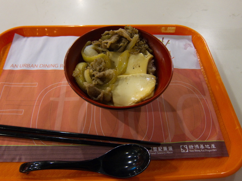 Hong Kong-Mong Kok - Heres what I got, chewy beef on old rice with some very soft tofu. I hardly ate any of it.
