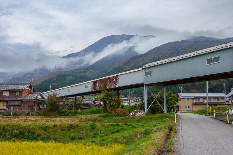 Japan for the 10th time (Finally!) - October and November 2023 - Getting closer to it on my run up from the station. That enclosed roadway is a conveyor with quarry materials coming down from the side of the mountai