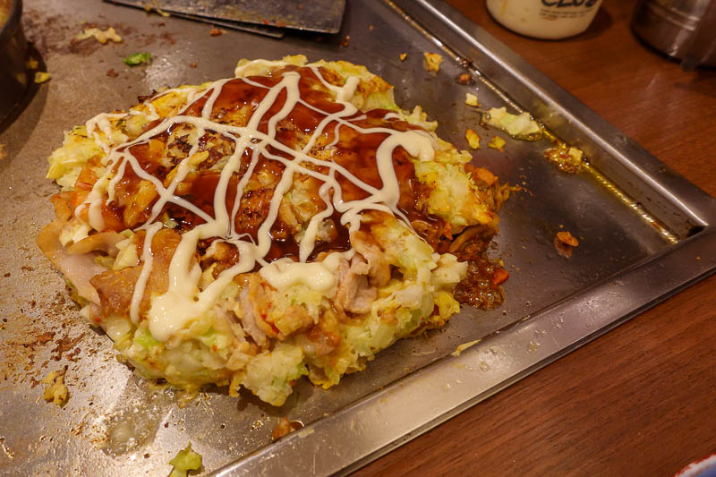 Japan-Tokyo-Ikebukuro-Okonomiyaki - Dinner was a make it yourself Okonomiyaki. I did ok. The flip was poor, but I saved it with sauce. I chose pork and kim chi. This is not the style tha
