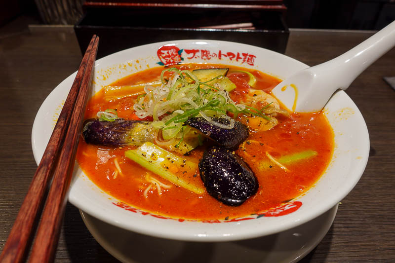 Japan for the 10th time (Finally!) - October and November 2023 - And finally, my Tomato ramen. The black stuff is egg plant. It was OK, but not as good as I remember. A quick google suggests it is part of a chain, b