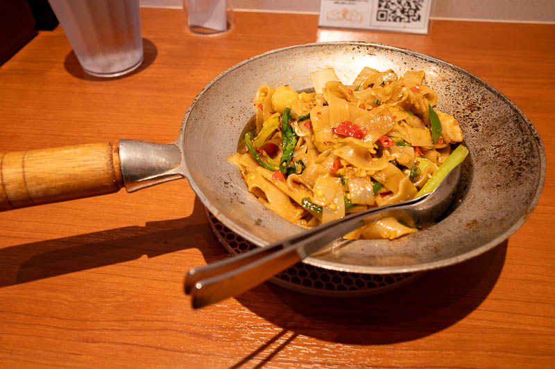 Japan-Tokyo-Shibuya-Halloween - And here it is, my spicy Thai drunk chicken noodles. It looks quite a bit different to the order on your phone menu picture, but it was pretty good.