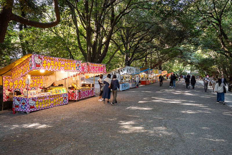 Back to Japan for the 11th time - October and November 2024 - Today the shrine is as busy as it gets, and there are numerous vendors setup on all sides selling fried orange things on sticks.