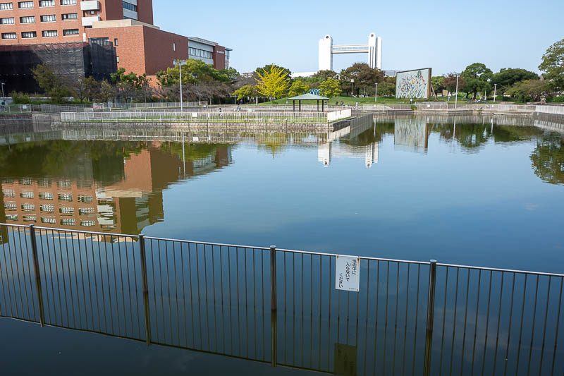 Back to Japan for the 11th time - October and November 2024 - After exiting the garden, I walked along a river and got to another sewage pond looking area, but what is that weird building in the distance? Let's g