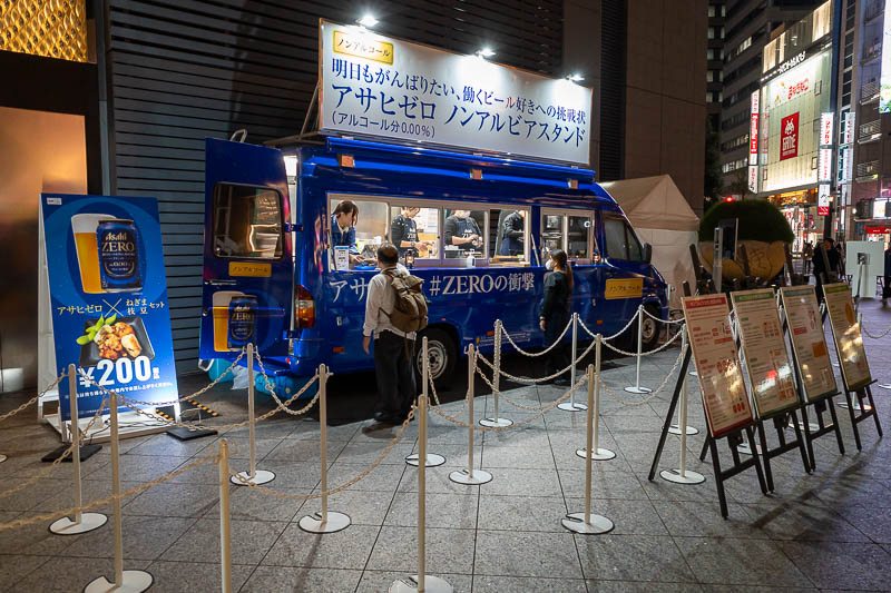 Japan-Nagoya-Mall - Just outside of my hotel, Asahi has been trying to give away 0% alcohol beer for a few days now, without much success. The 200 yen on the sign is to b