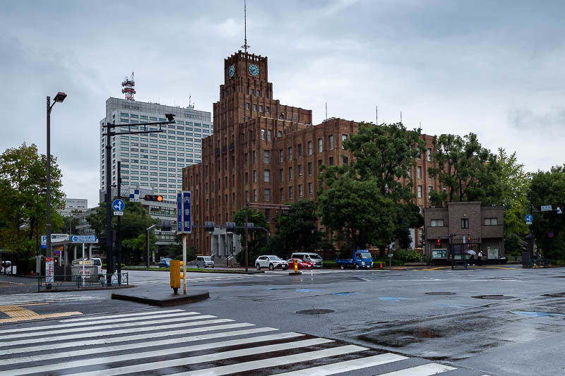 Japan-Tokyo-Garden-Rain - This photo is just to show that it is raining. Even though that is kind of a cool looking old brick building over there.