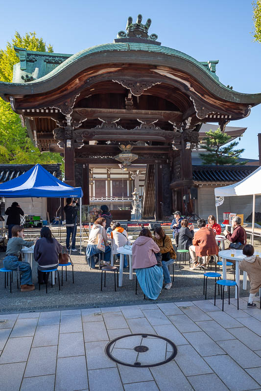 Back to Japan for the 11th time - October and November 2024 - Last pic of the day is the shrine at the centre of the shopping street. You could buy twisted potato on a stick from here. They set up tables for you 