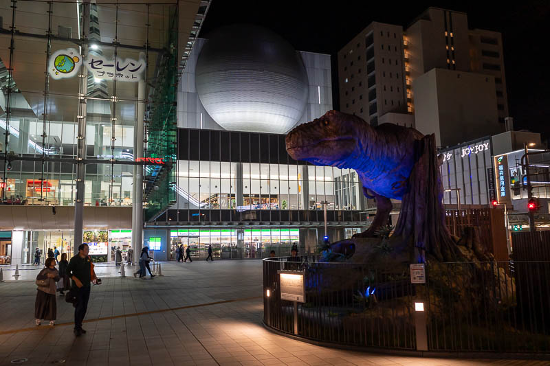 Back to Japan for the 11th time - October and November 2024 - Back at the station now and we have another animatronic dinosaur, with the concert hall sphere behind it. That building also has 2 levels of restauran