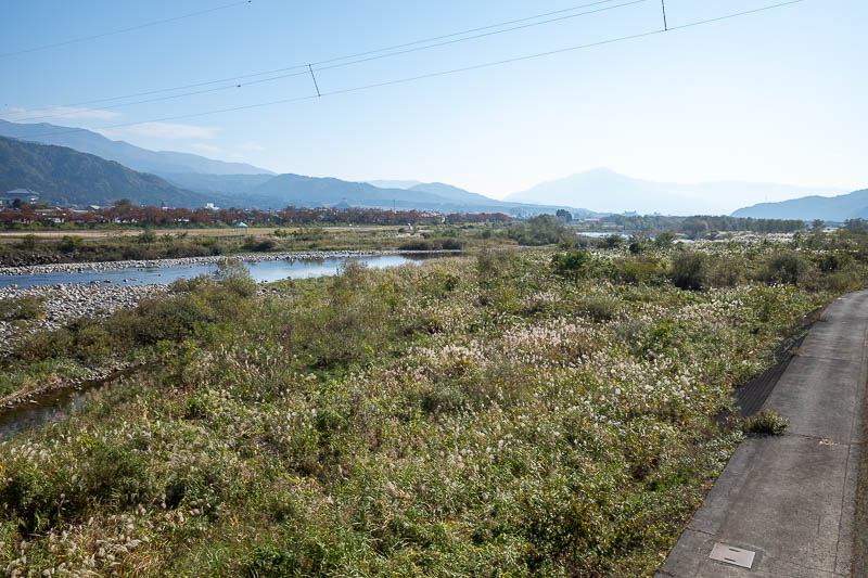 Japan-Fukui-Dinosaur-Museum - I had 20 minutes until the single carriage train arrived to take me back to Fukui, so here is a smokey shot up into the bigger mountains, apparently t