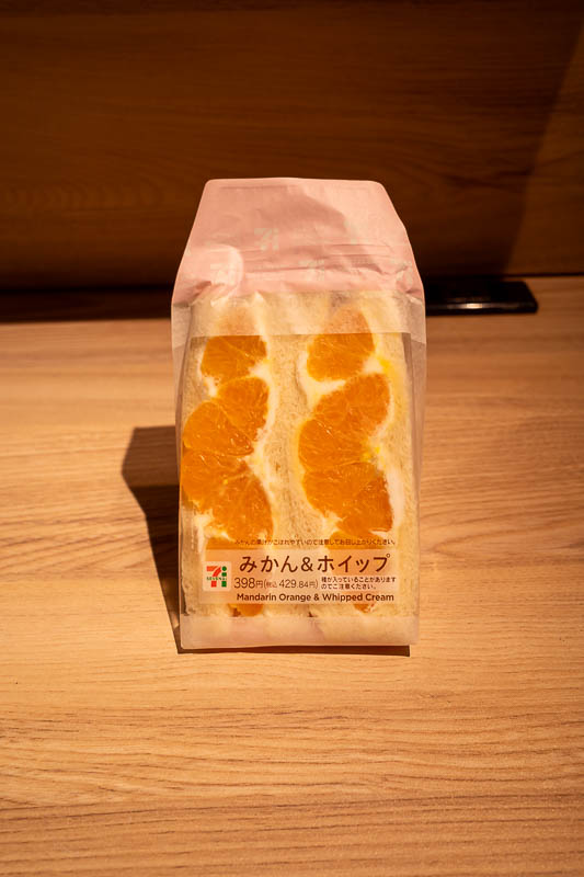 Japan-Fukui-Tokyo-Shinkansen - And here is my lunch/afternoon tea. A mandarin and whipped cream sandwich. I prefer the kiwi and strawberry one, but they did not have it. Now to chec