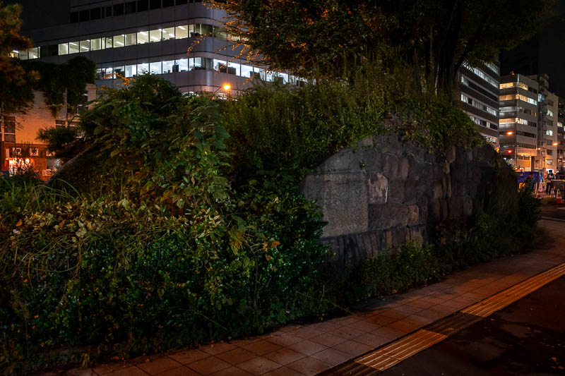 Japan-Tokyo-Shinagawa - Here it is in all it's glory, the ruins of the Takanawa gate, right in the middle of a footpath with construction equipment parked on it.