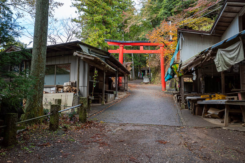 Japan-Tokyo-Hiking-Mount Izugatake - This is where you walk along the road to go through the shrine, there are some old produce stalls here but it looks like they have not been used for m