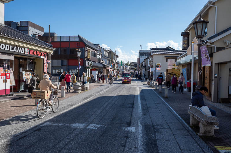 Japan-Tokyo-Narita-Haneda - Now for the tourist street. It winds it's way down a hill. The traffic situation was horrendous, cars and trucks nearly running people over.