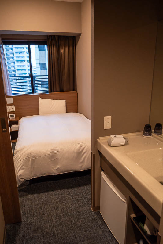 Japan-Tokyo-Kobe-Shinkansen - Now for my hotel. I seem to be setting a new expectation of three boring hotel pictures per hotel. This one does not have 2 desks, but it does have th