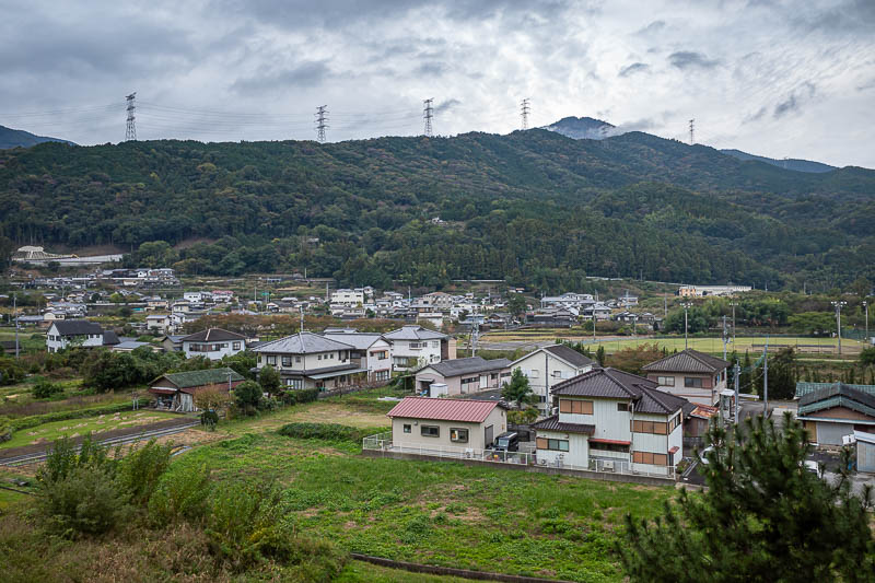 Trip 13 to Japan - October and November 2025 - Here you can just see the mountain, in the distance past the ridge in the foreground with the giant electricity things on it.