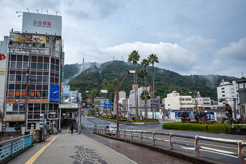 Japan-Tokushima-Castle-Mount Bizan - It appears to have rained all night. Lots of puddles but no rain now. There is mighty Mount Bizan, with some fog hanging around. I headed straight to 