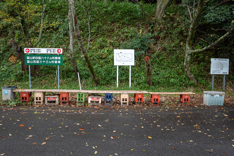 Japan-Tokushima-Castle-Mount Bizan - The staircase ends at this bizarre makeshift seating area with coke crates and bamboo. What was strange is that there are numerous real seats very nea