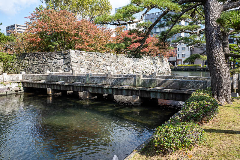 Japan-Tokushima-Castle-Mount Bizan - Next up, the castle. Nice moat and bridge. The sign talks about this being a historic wooden bridge and various battles. It is now however, concrete.