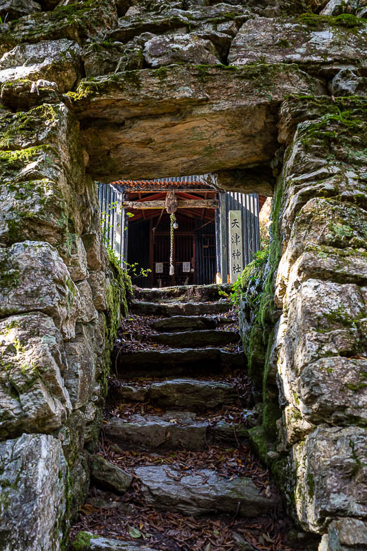 Japan-Tokushima-Hiking-Mount Nakatsumine - Arriving at the summit of Nakatsumine (I think), and you have to go through a hole in the wall. Maybe the shed through the hole is a shrine, but I don