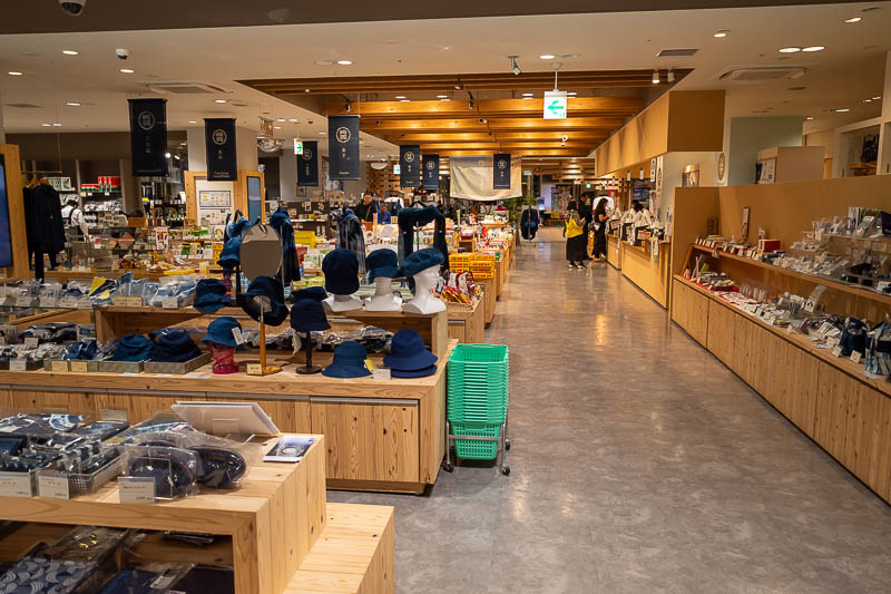 Japan-Tokushima-Curry - The bottom of the dance exhibition cable car station also features a tourist souvenir shopping extravaganza. The dark blue (indigo?) theme seems to be