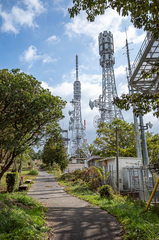 Japan-Takamatsu-Hiking-Kotohira - Right at the top is the usual array of communications equipment, and a road. There was a giant fence with barbed wire on this road, more so than usual