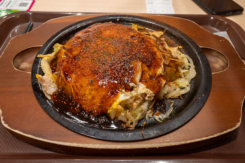Japan-Takamatsu-Okonomiyaki-Mall - And here it is, Okonomiyaki. 1,000 yen. A real bargain as it was delicious. To get to Okayama tomorrow takes about an hour on the slow train, I will h