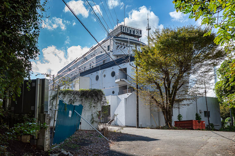Japan-Tokyo-Hiking-Hachiokayama - Near the end and there are some possibly abandoned hotels. This one is shaped like a ship. I saw snake number two of two near here, on the road.