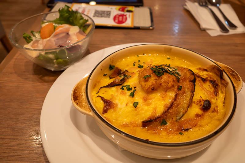 Trip 13 to Japan - October and November 2025 - That is not pork, it is pumpkin. Pumpkin omurice doria to be precise. So omurice with pumpkin on top, then cheese, then they put it in the oven for a 