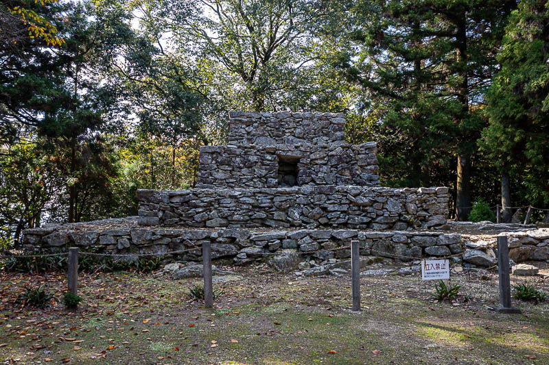Trip 13 to Japan - October and November 2025 - The reason the area is well known and has a road up to it the public can use are these ruins. There were a couple of cars around here.