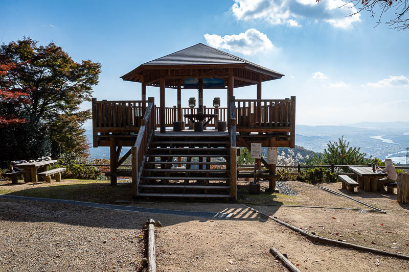 Trip 13 to Japan - October and November 2025 - And at the nearby view spot, here are the only 2 other people I saw all day. Lady on the right and a guy sleeping on the left.