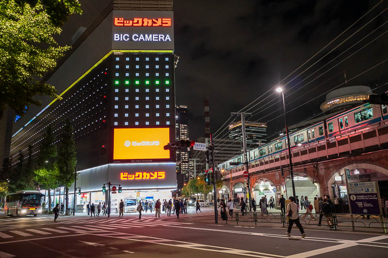 Japan-Tokyo-Yurakucho-Shimbashi - Yurakucho, with a camera shop, and more train tunnels.