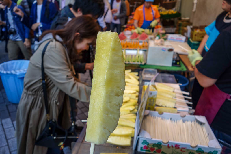 Japan 2015 - Tokyo - Nagoya - Hiroshima - Shimonoseki - Fukuoka - To keep hunger at bay, I settled for pineapple on a stick, which was actually great. The jar it came out of was enormous.