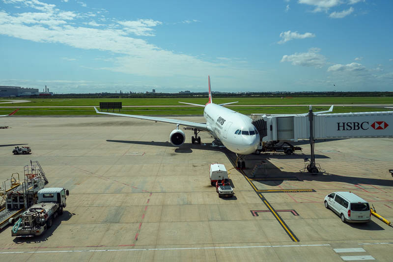 Japan 2015 - Tokyo - Nagoya - Hiroshima - Shimonoseki - Fukuoka - My plane on the ground in Brisbane, in the sunshine. An Airbus A330, people used to be frightened of these, but now its the Boeing 777 that keeps bein