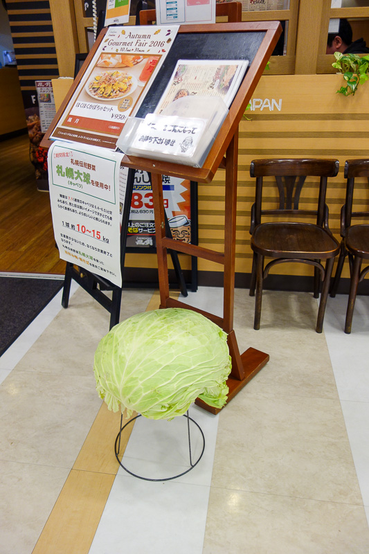 Japan-Sapooro-Mall-Food-Okonomiyaki - This restaurant in the basement has a giant cabbage on stand, and a sign which I think is proudly describing this huge cabbage they have grown. After 
