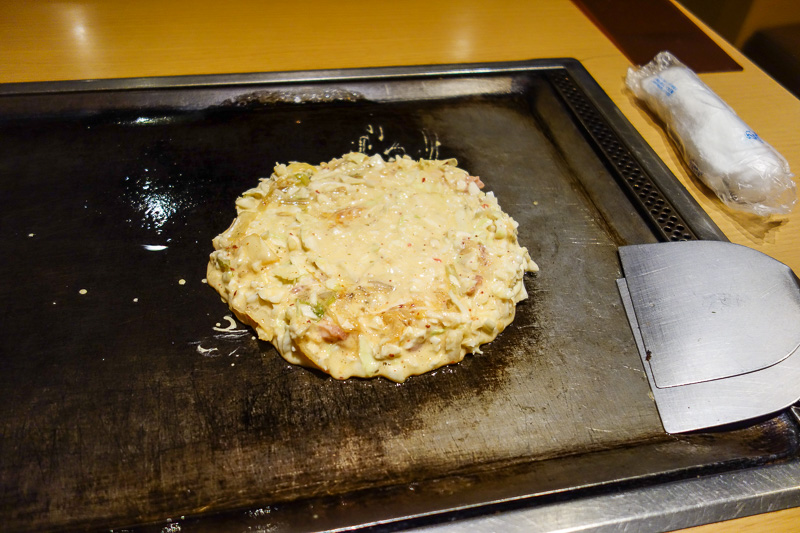 Visiting 9 cities in Japan - Oct and Nov 2016 - The problem is, its a cook your own Okonomiyaki restaurant, so now I have to pay to do someone elses job. Step one, vomit onto the grill, try to proje