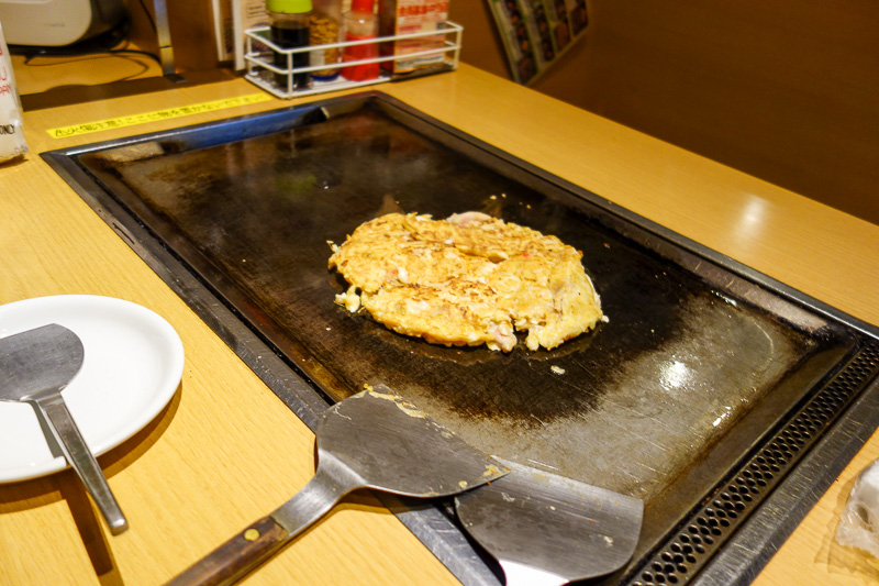 Japan-Sapooro-Mall-Food-Okonomiyaki - Step 2. Await the onlooking concerned gaze of all the staff in the restaurant, then fake them out by grabbing the flipping things and putting them dow