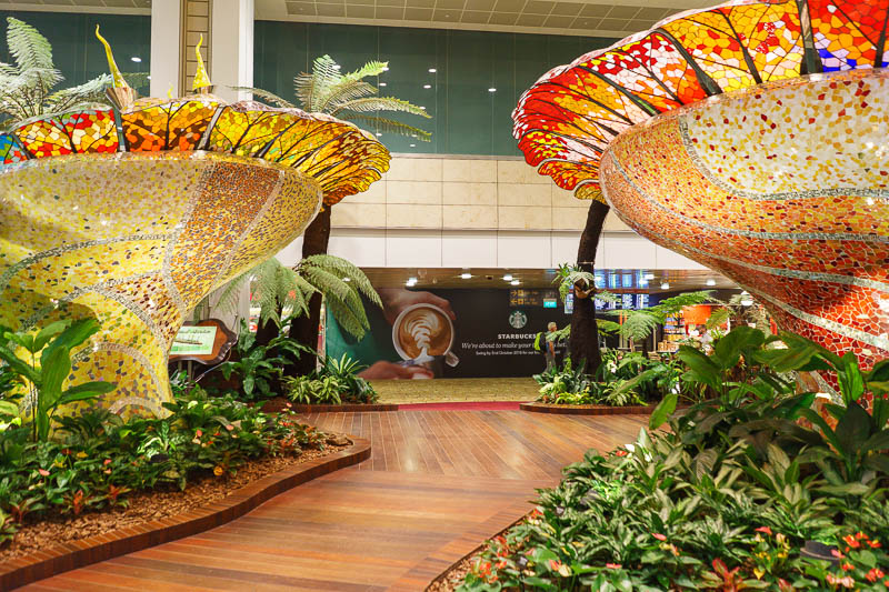 Melbourne-Singapore-Airport - Here is a plastic and glass tropical garden in Singapore airport. They need to dust it more often.