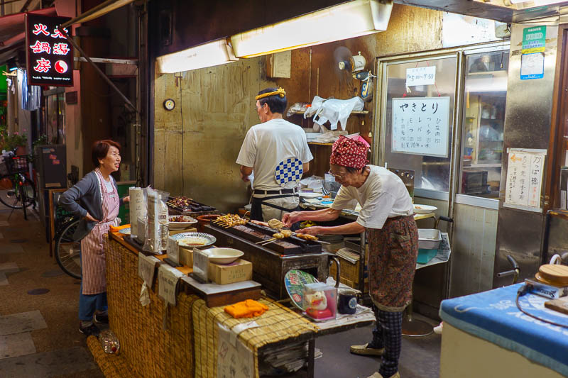 Of course I am back in Japan yet again - Oct and Nov 2018 - This old lady lost all her money on bitcoin so now she has to grill mystery meat on sticks in the middle of the night and sell them to passing strange