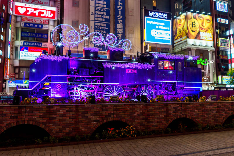 Japan-Tokyo-Shimbashi-Food - Right next to where the racist idiots had parked is this train dressed up in Christmas lights driven by Santa. Perhaps the Japanese KKK had bought the